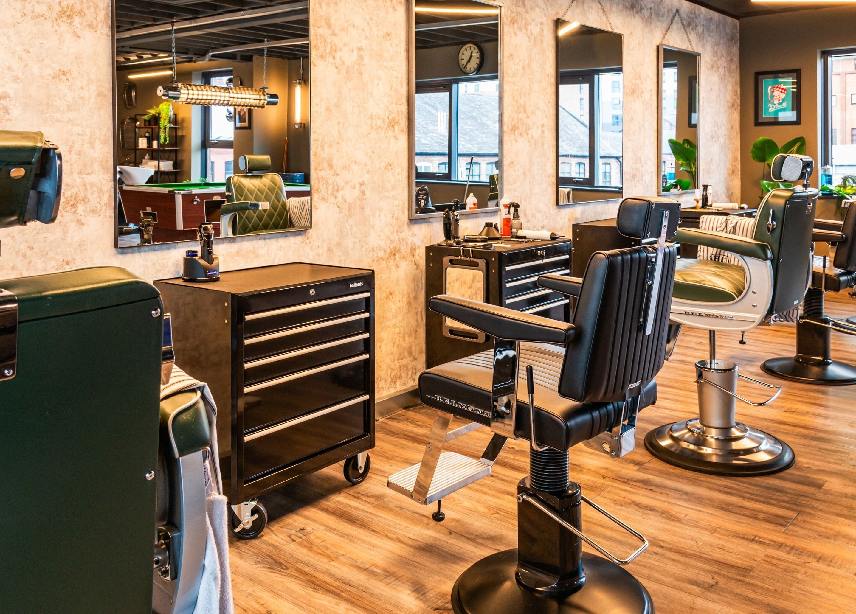 Elegant interior of Boilerhouse Gentleman - Ouseburn, Newcastle upon Tyne featuring classic barber chairs.
