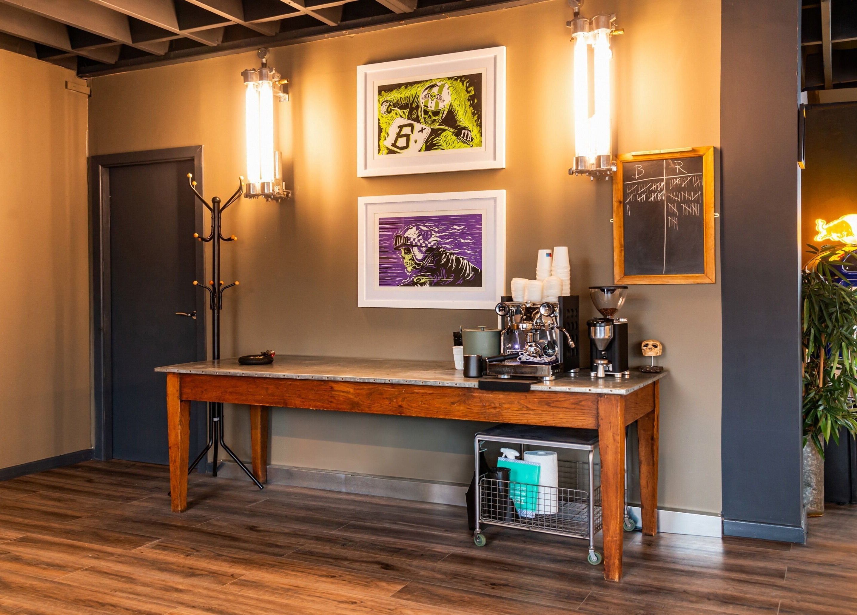 Chic lounge at Boilerhouse Gentleman - Ouseburn, Newcastle upon Tyne, England, with art and refreshments.