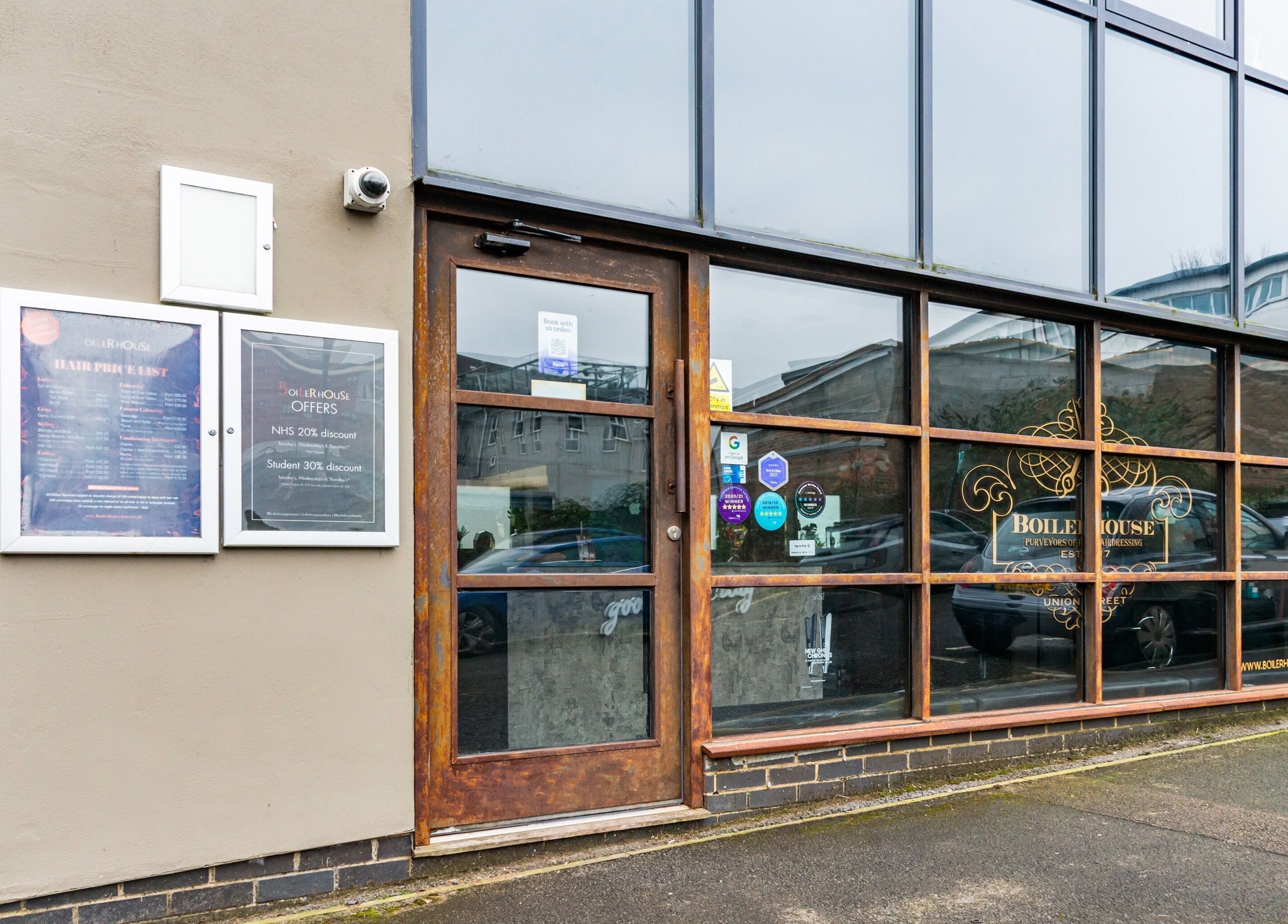 Entrance of Boilerhouse Gentleman - Ouseburn, Newcastle upon Tyne, England, GB, featuring modern glass panels.