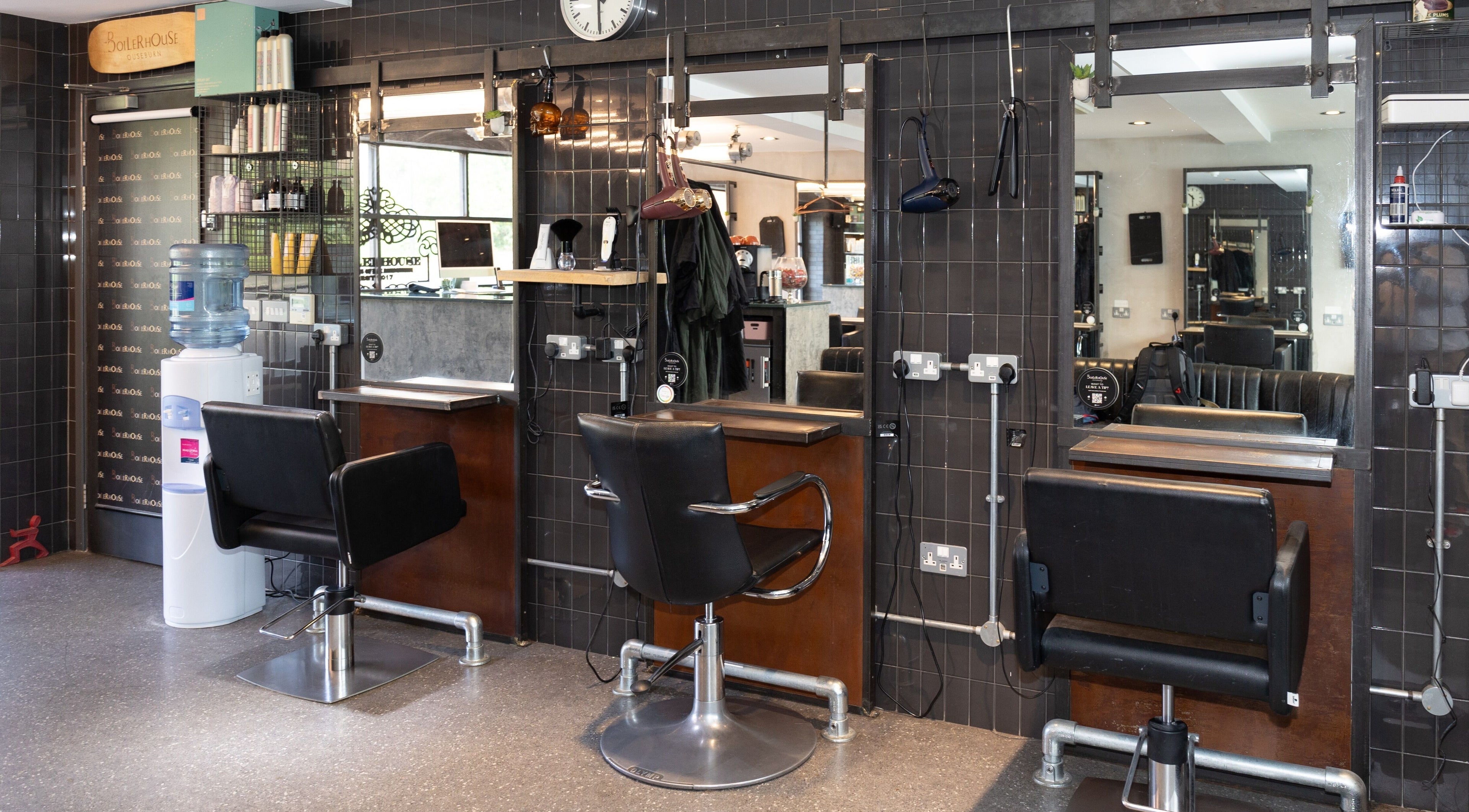 Modern interior of Boilerhouse - Ouseburn, Newcastle upon Tyne, GB, featuring styling stations and chic decor.