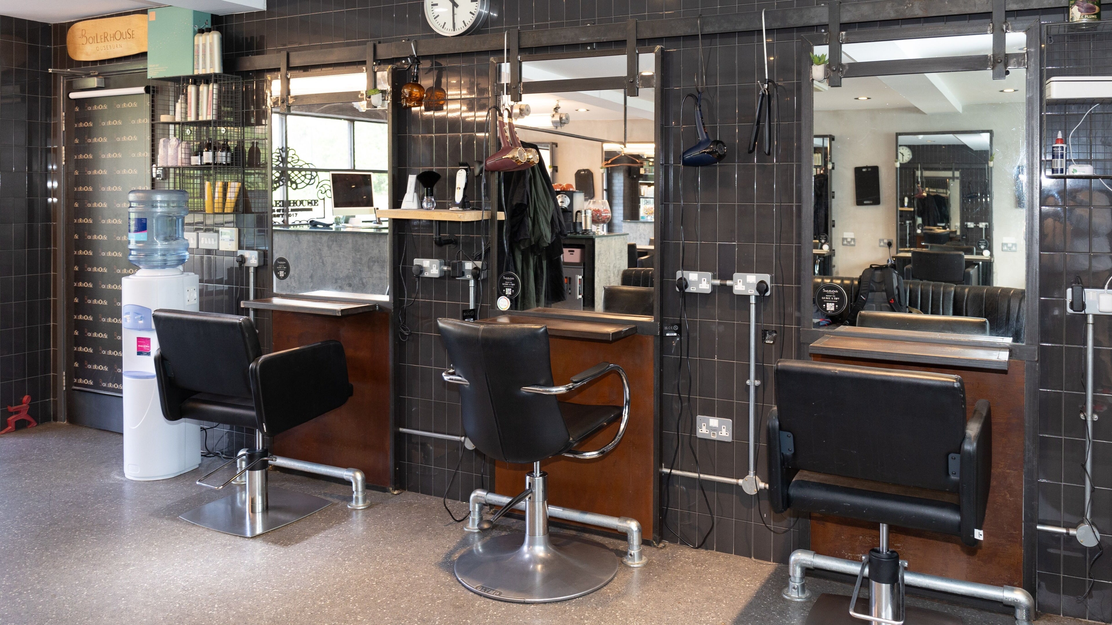 Modern interior of Boilerhouse - Ouseburn, Newcastle upon Tyne, GB, featuring styling stations and chic decor.