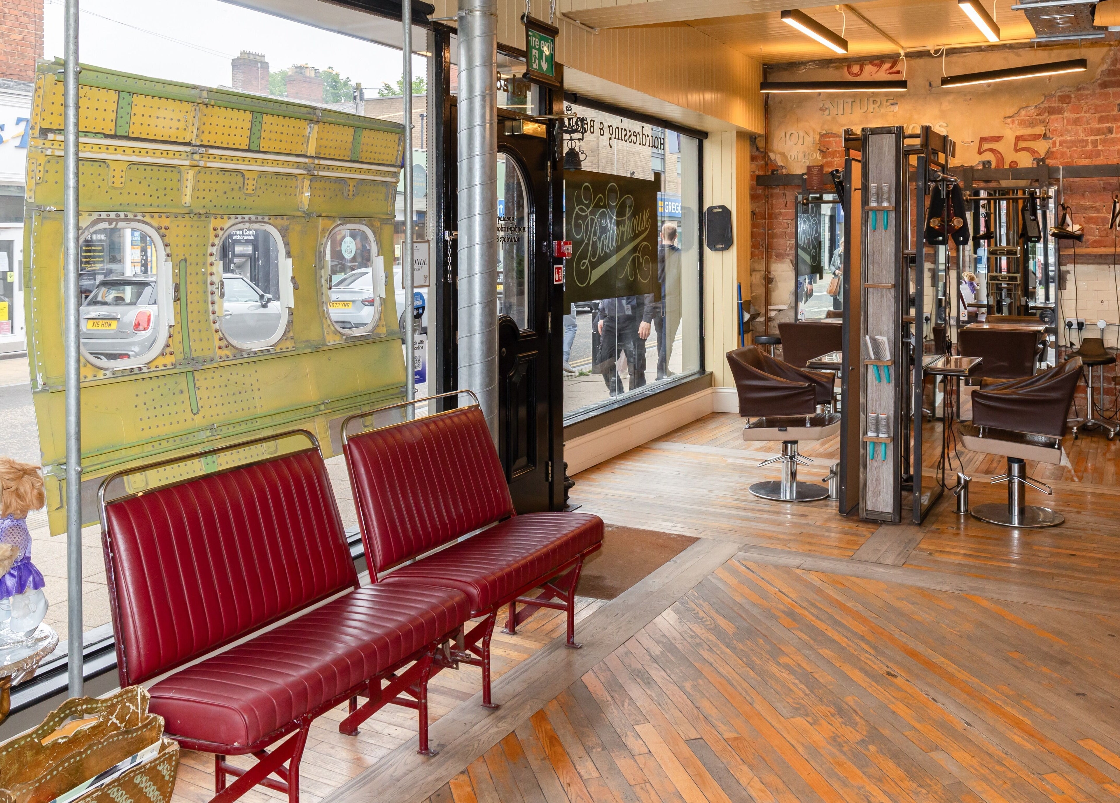 Interior of Boilerhouse - Jesmond, showing retro seating and styling stations, Newcastle upon Tyne, England, GB.