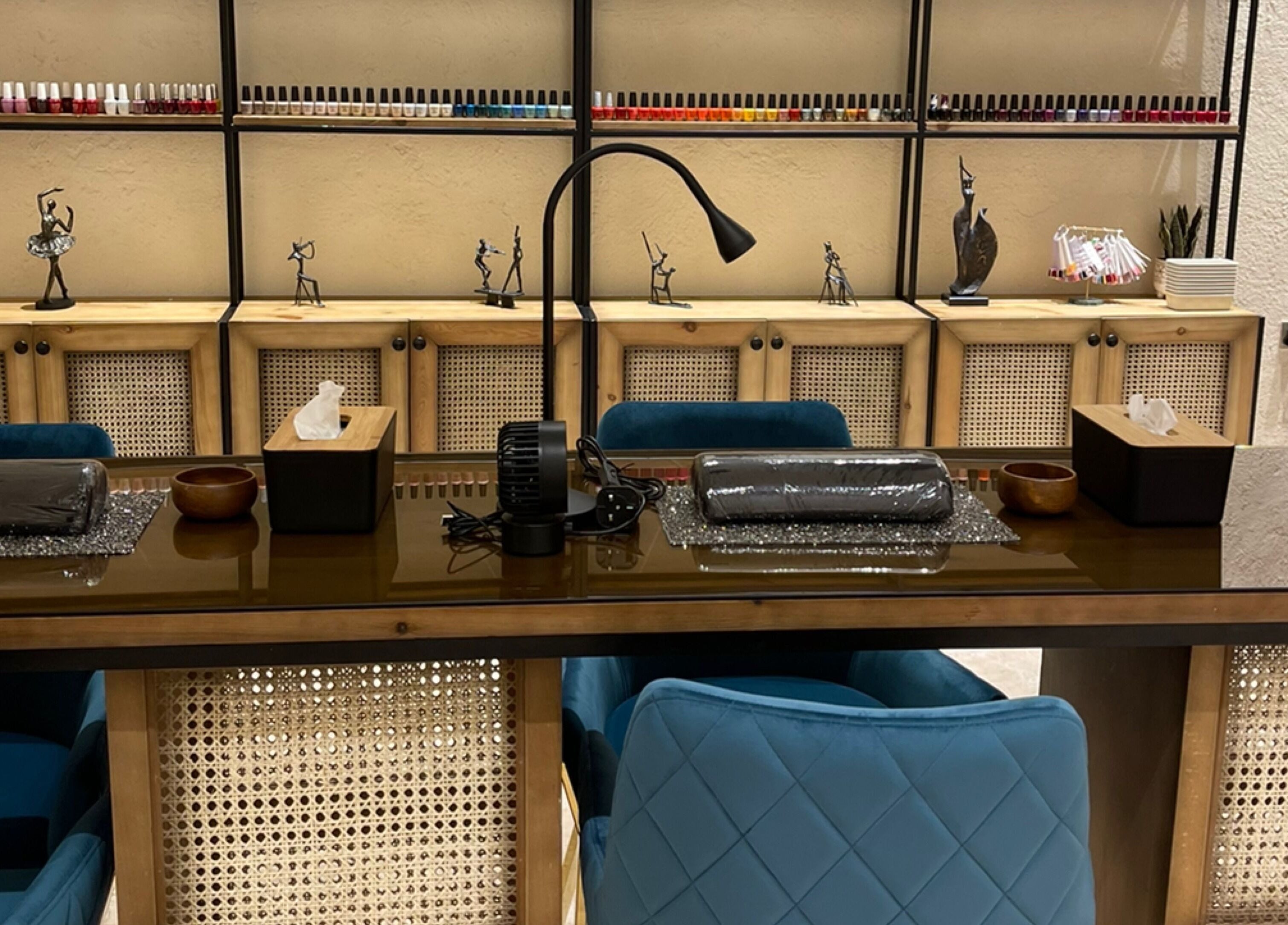 Chic nail salon workstation at The Bliss Nails, Riyadh, SA, showcasing elegant decor and serene atmosphere.