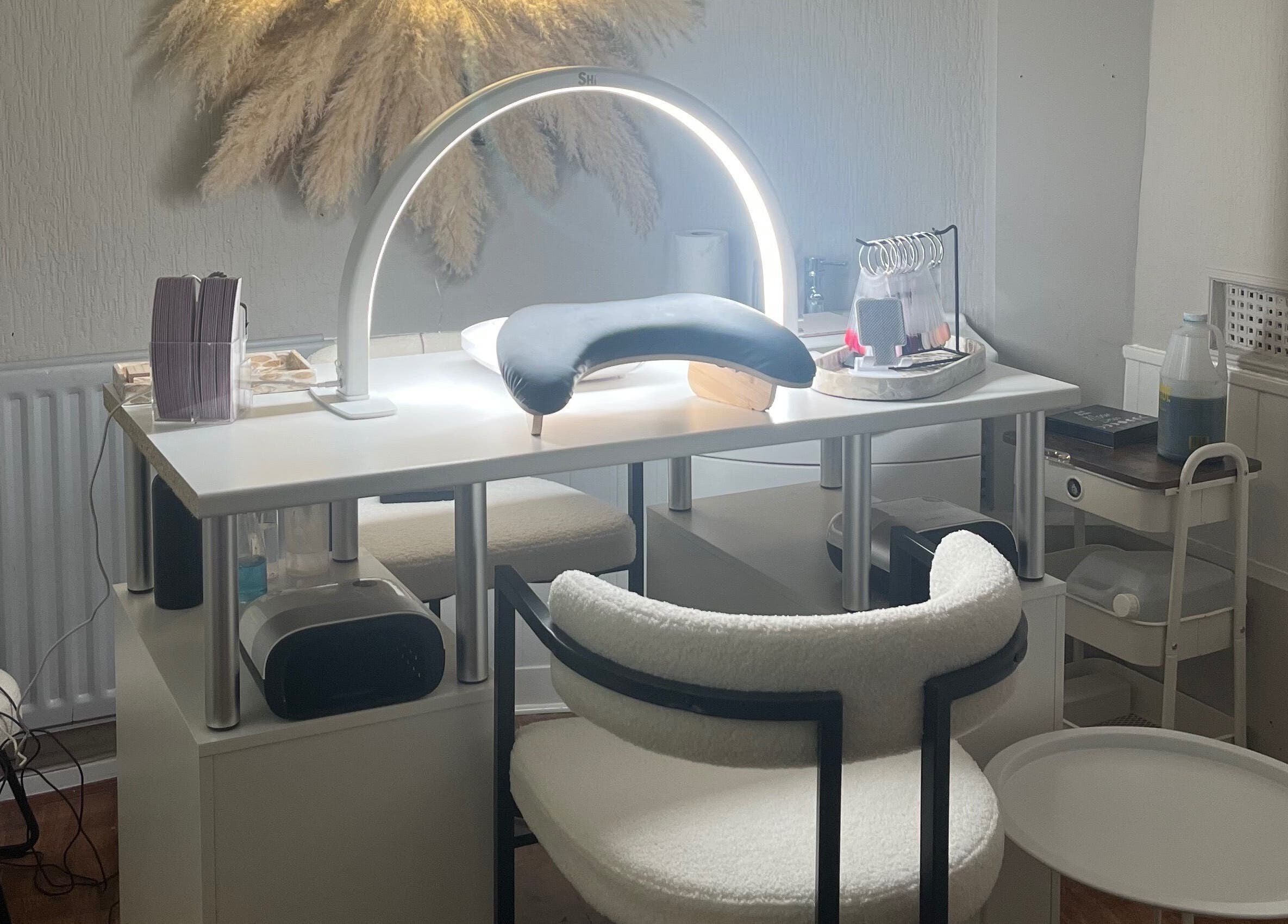 Elegant nail care setup at Bella by Ella, Douglas, with modern lighting and tools.