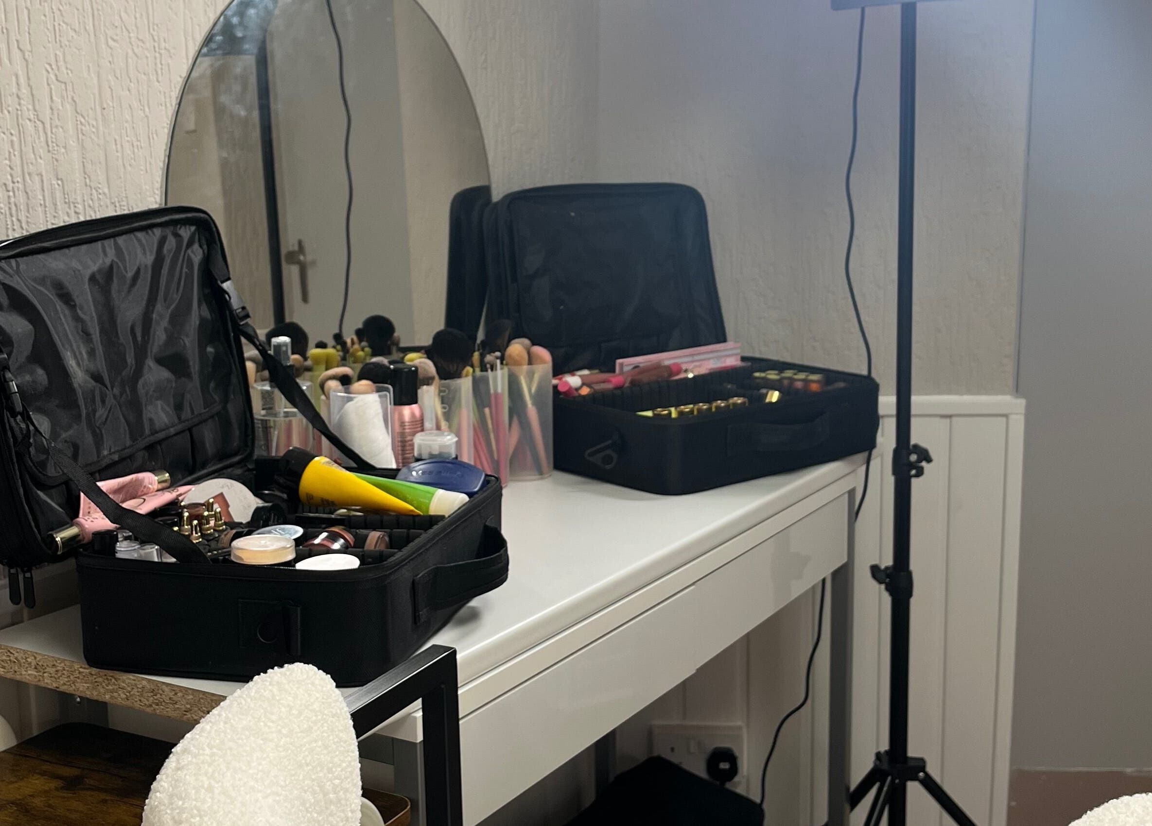 Makeup setup at Bella by Ella in Douglas, Douglas, IM, featuring a vanity with beauty products.