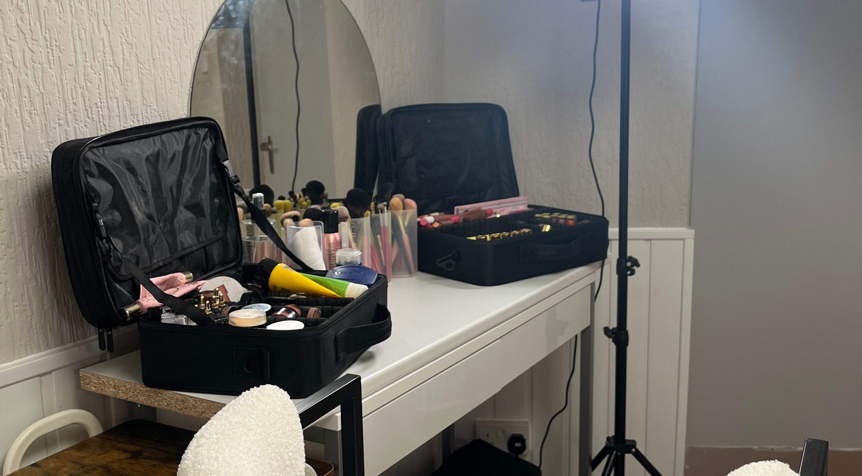 Makeup setup at Bella by Ella in Douglas, Douglas, IM, featuring a vanity with beauty products.