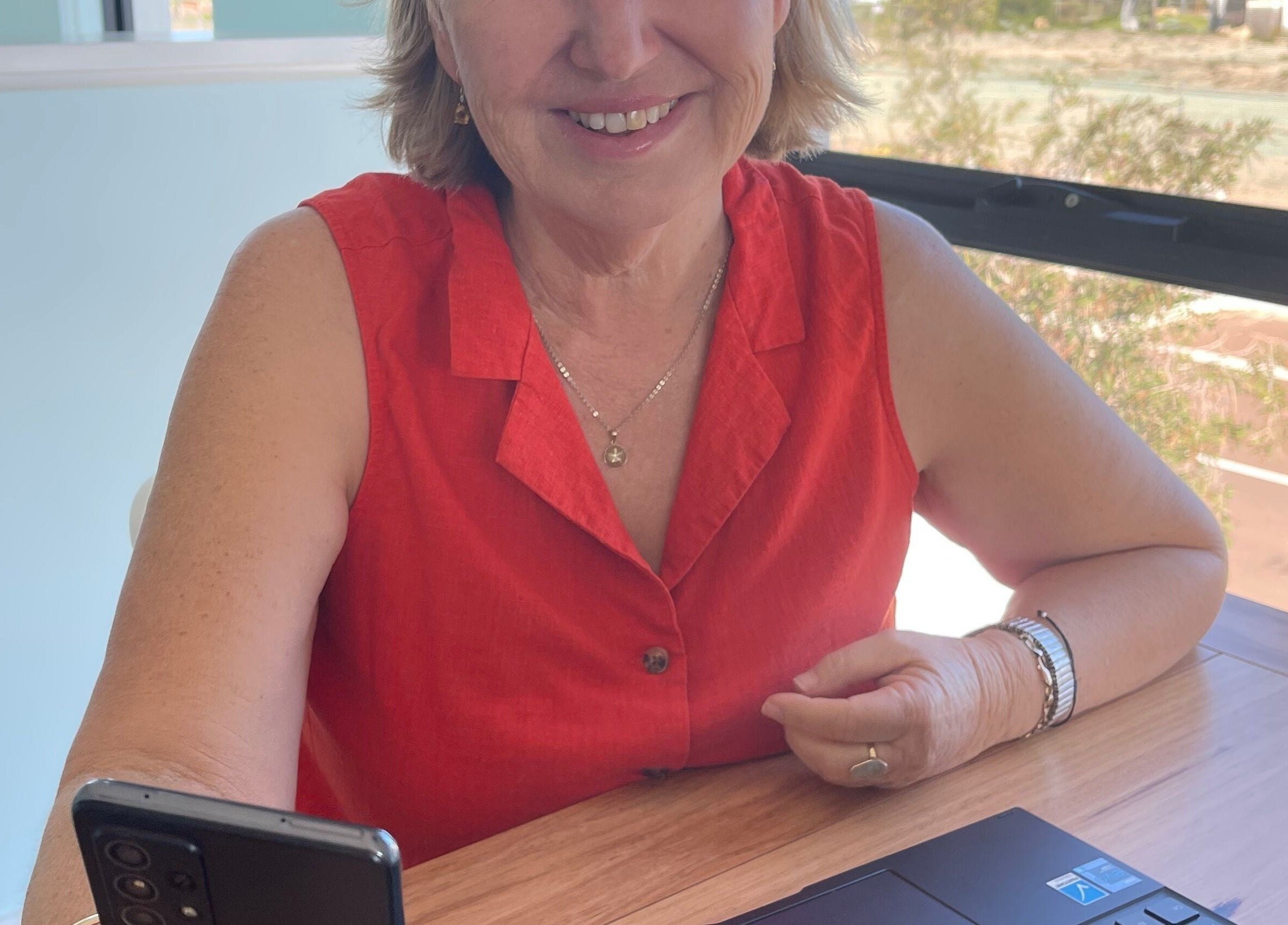 Smiling person in red top at Refresh Medi Spa - Port Kennedy, Port Kennedy, Western Australia, AU.
