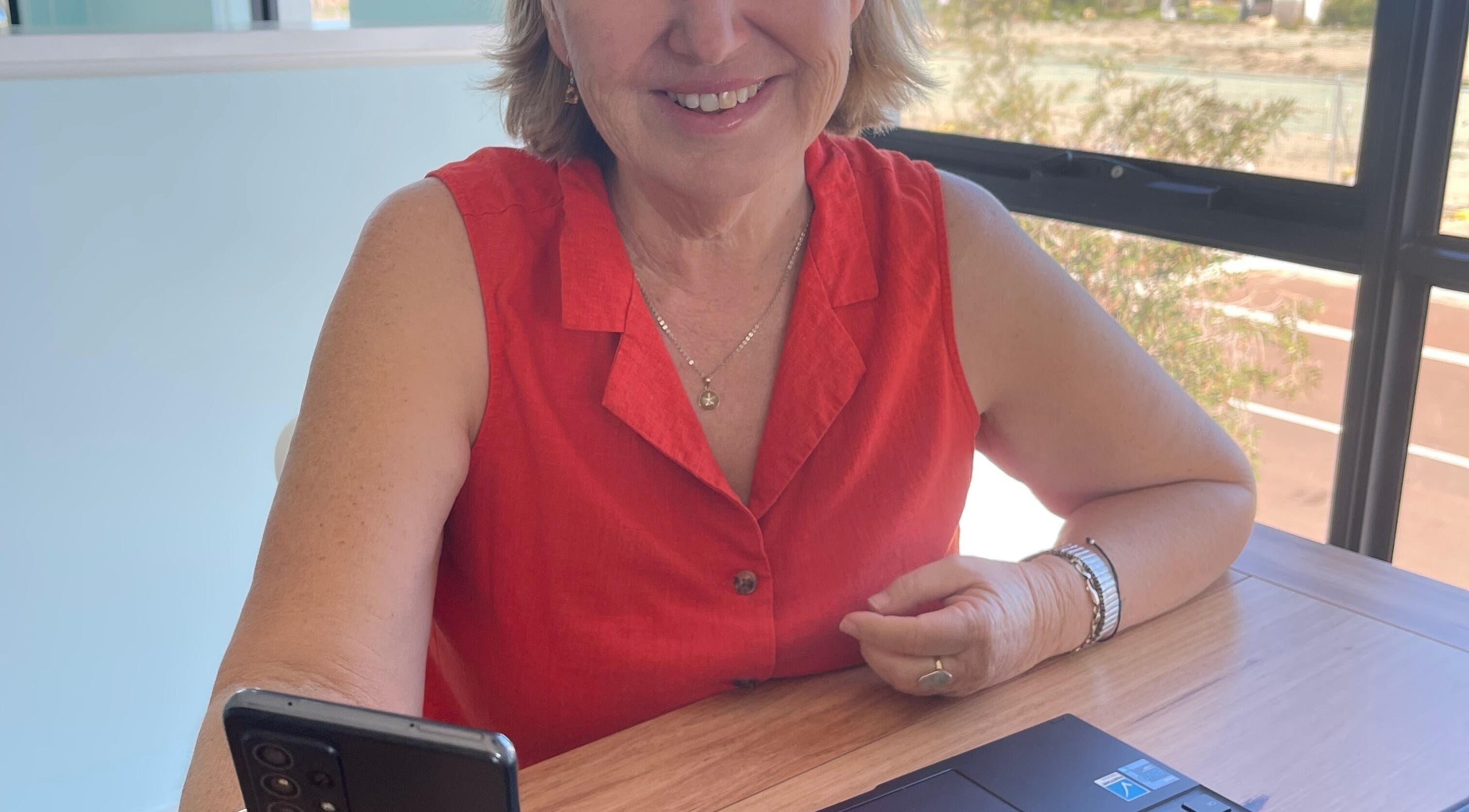 Smiling person in red top at Refresh Medi Spa - Port Kennedy, Port Kennedy, Western Australia, AU.