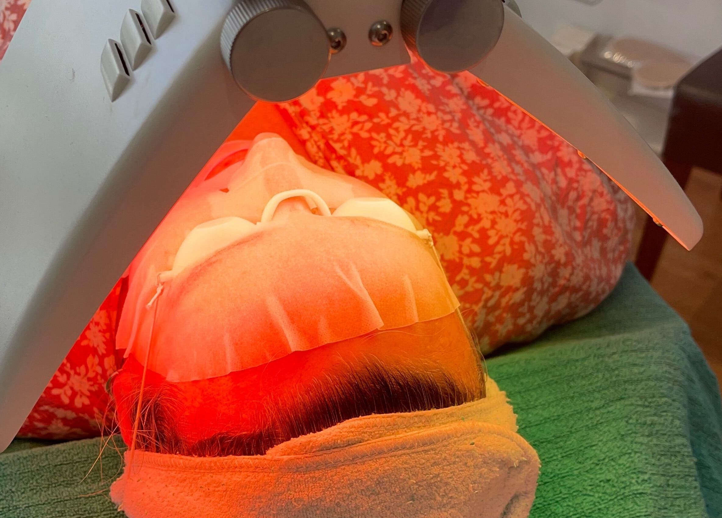 Client enjoying LED facial treatment at Refresh Medi Spa - Port Kennedy, Western Australia, AU.