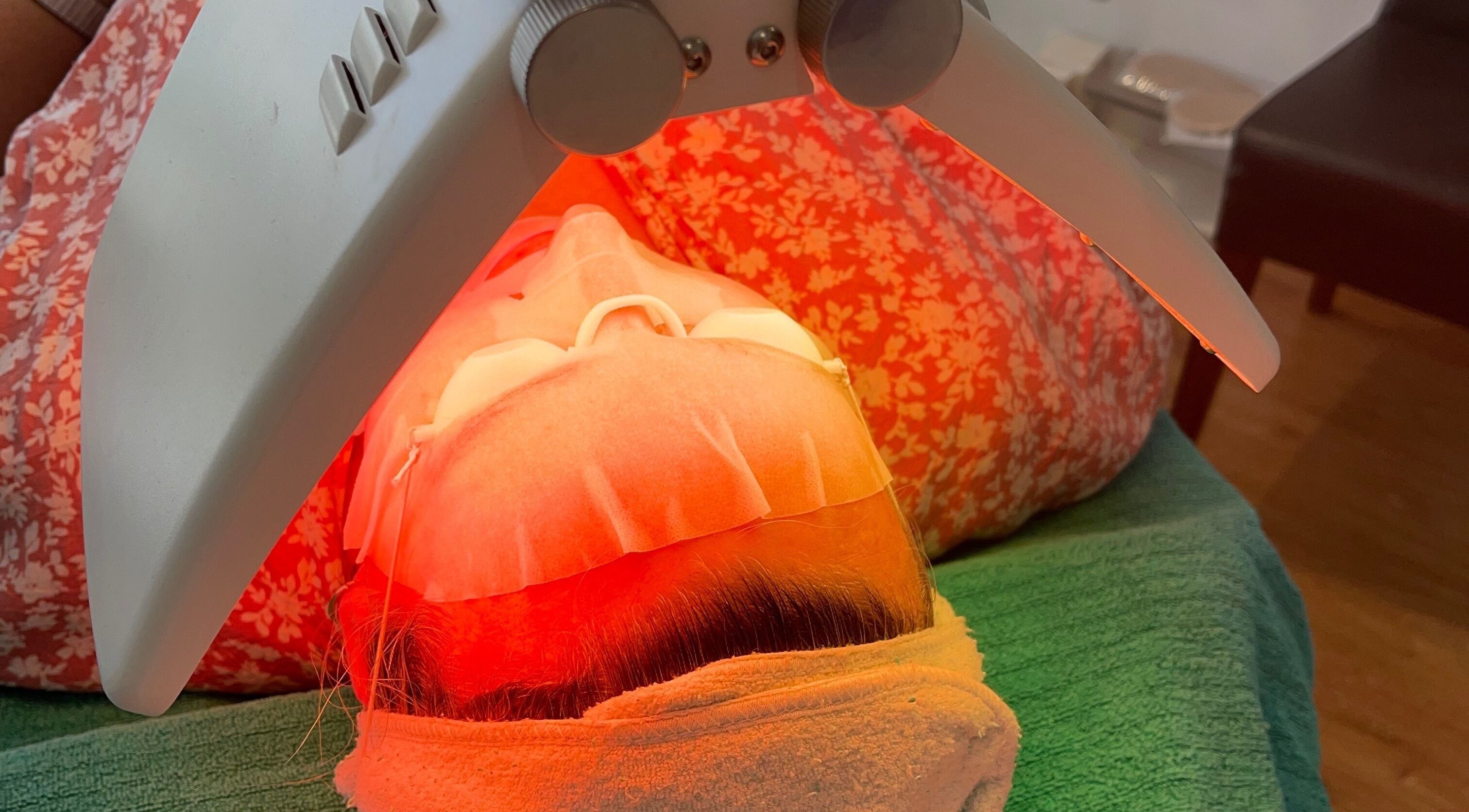 Client enjoying LED facial treatment at Refresh Medi Spa - Port Kennedy, Western Australia, AU.