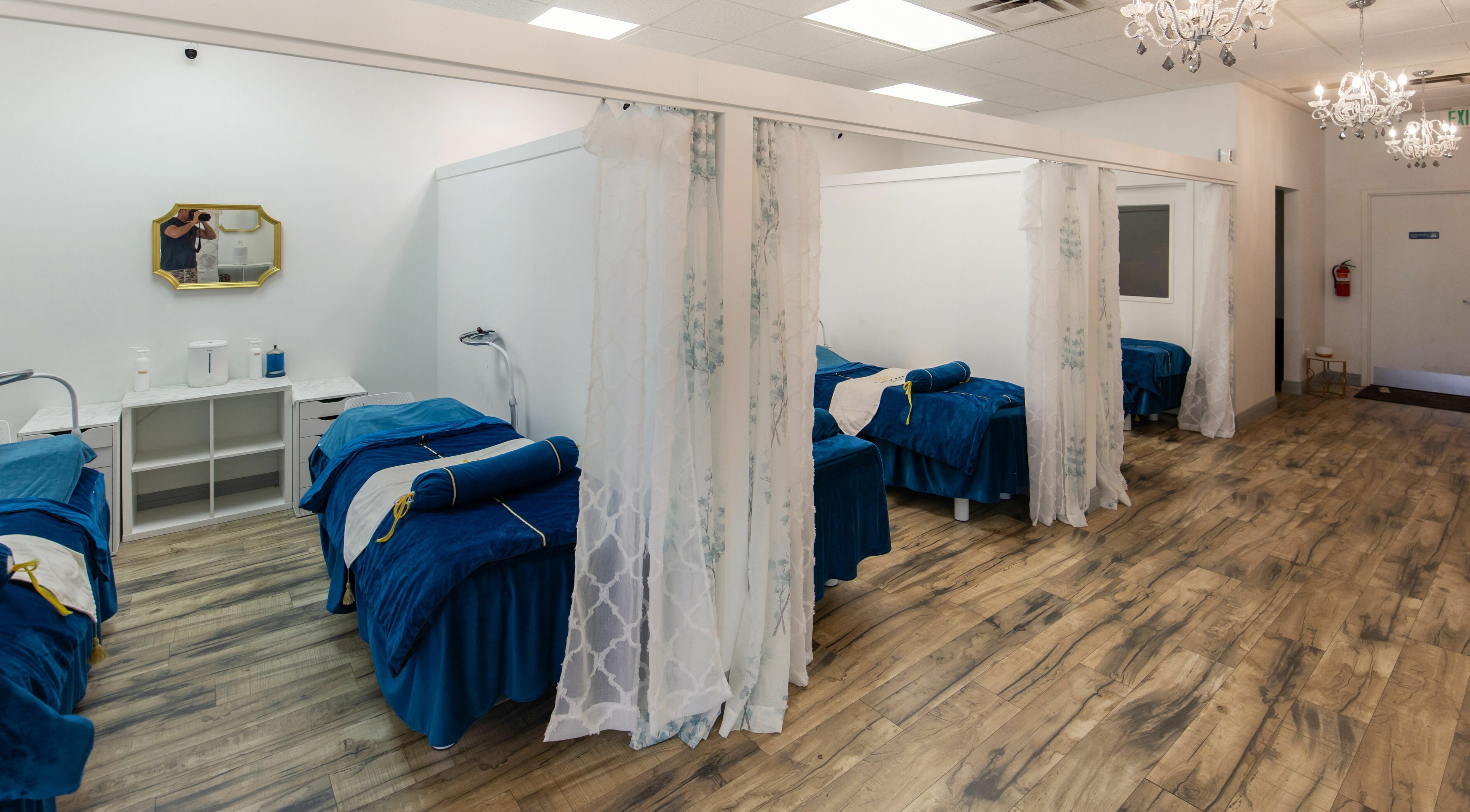 Luxurious treatment rooms at I Lash For U in Saratoga Springs, Utah, US with plush blue bedding.