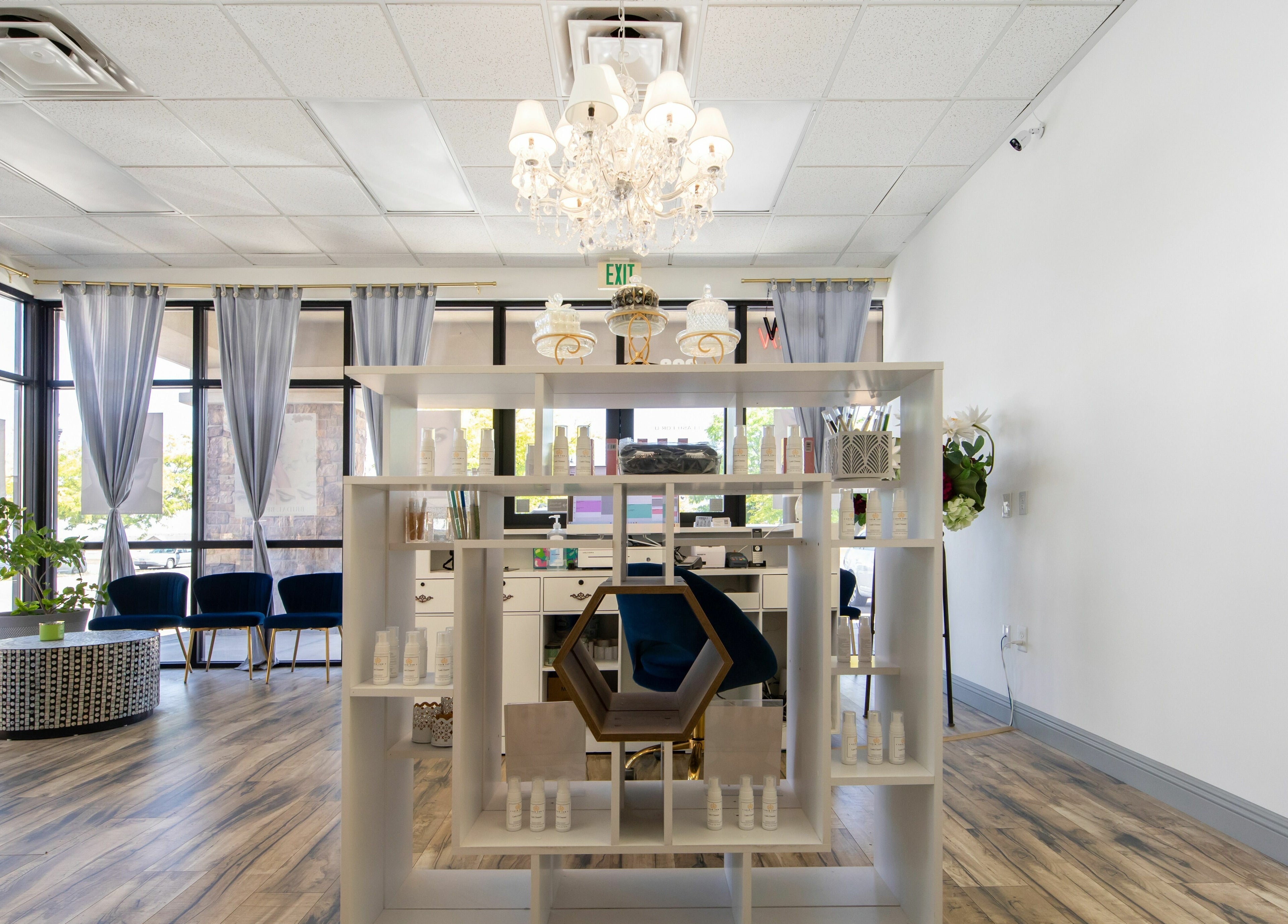 Elegant interior of I Lash For U in Saratoga Springs, Utah, showcasing modern decor and product display.