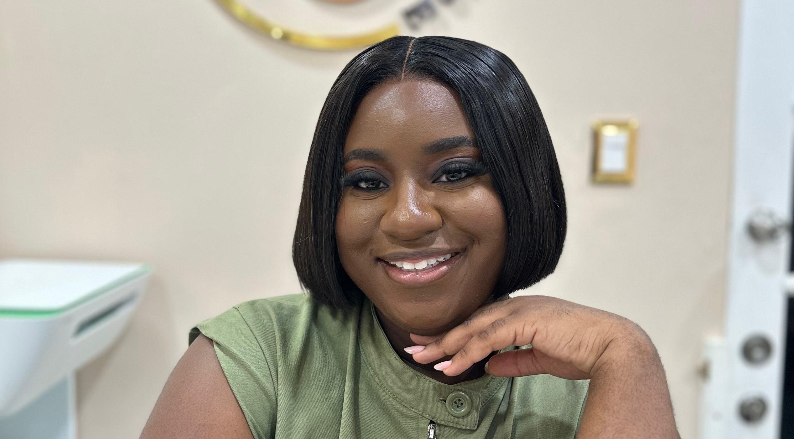 Smiling person at Skin Muse, Bon Accord, Western Tobago, TT, showcasing elegant beauty and welcoming ambiance.