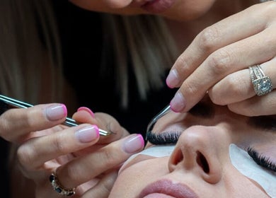 Close-up of eyelash application at BM Pressed in Westville, Kwazulu-natal, ZA, showcasing precise technique.