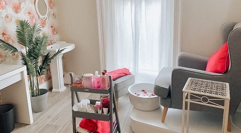 Relaxing spa area at The Beauty Lounge, Lowestoft, England, GB with a cozy chair and foot bath.