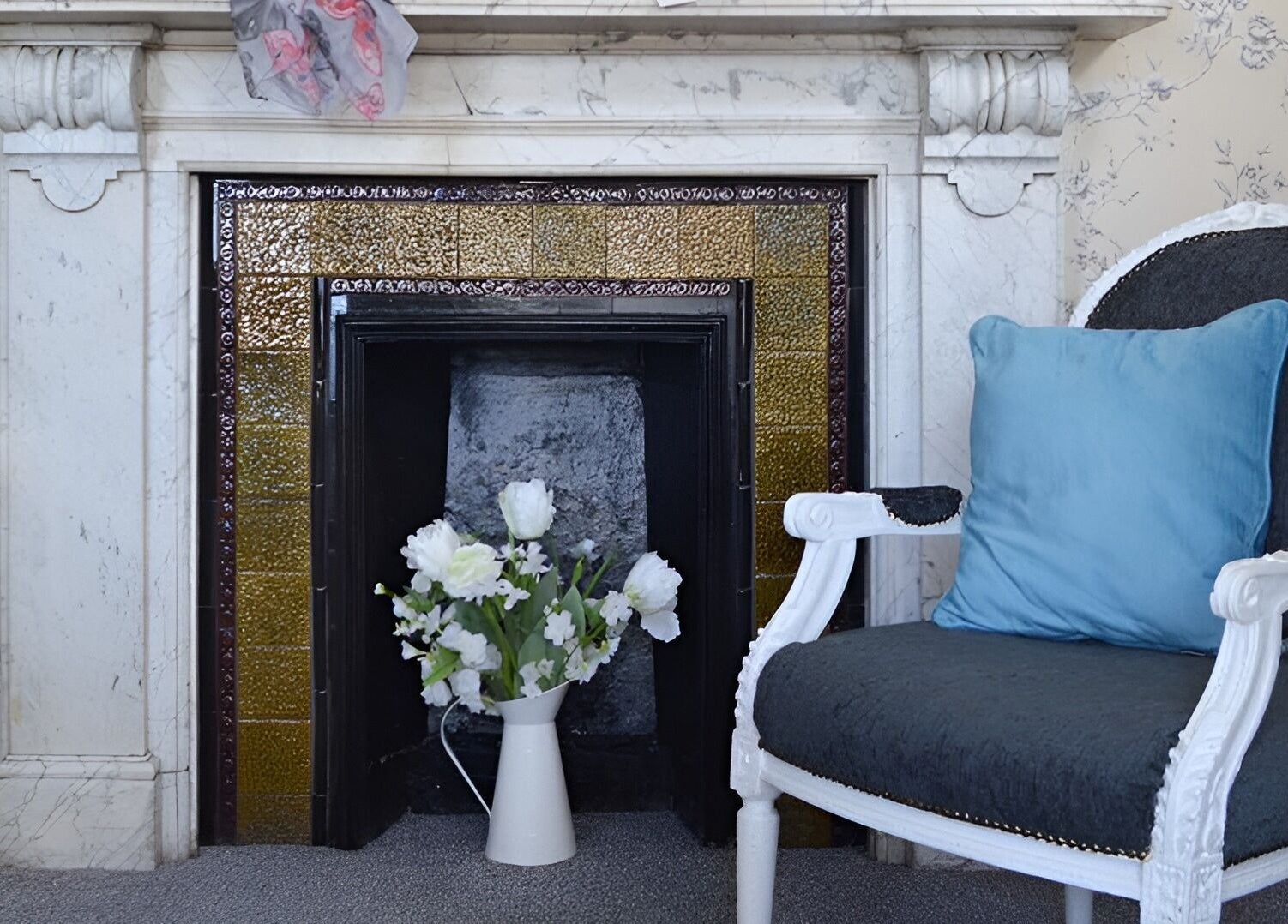 Elegant lounge area at The Beauty Lounge, Lowestoft, England, GB with plush chair and floral decor.
