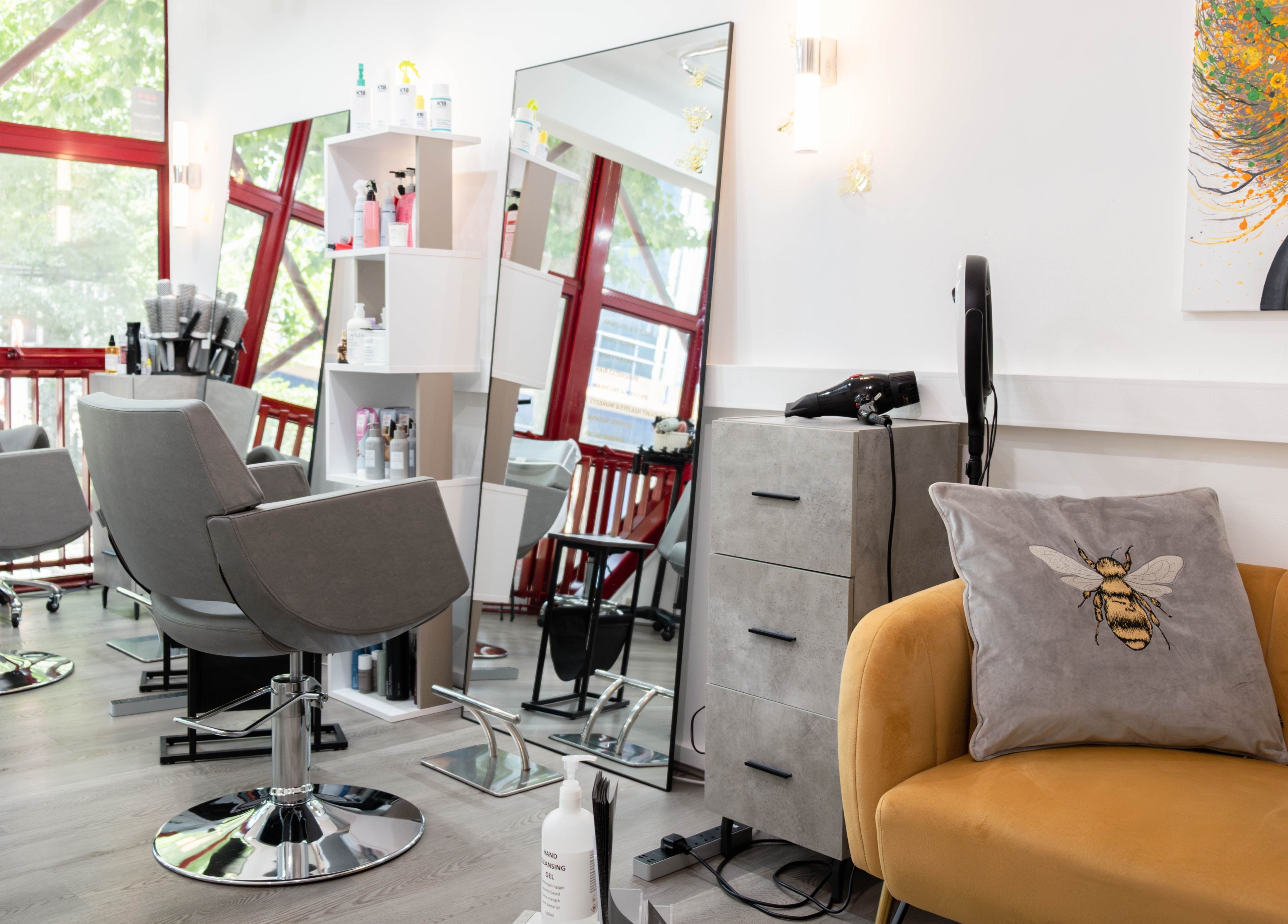 Modern salon interior at Hair Rituals by Ariana, London, England, GB with stylish chairs and decor.