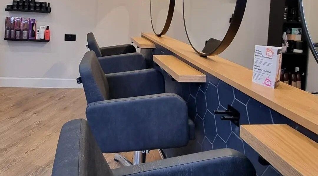 Modern salon interior with chairs at Onesixeight, Boston Spa, England, GB. Inviting and stylish atmosphere.