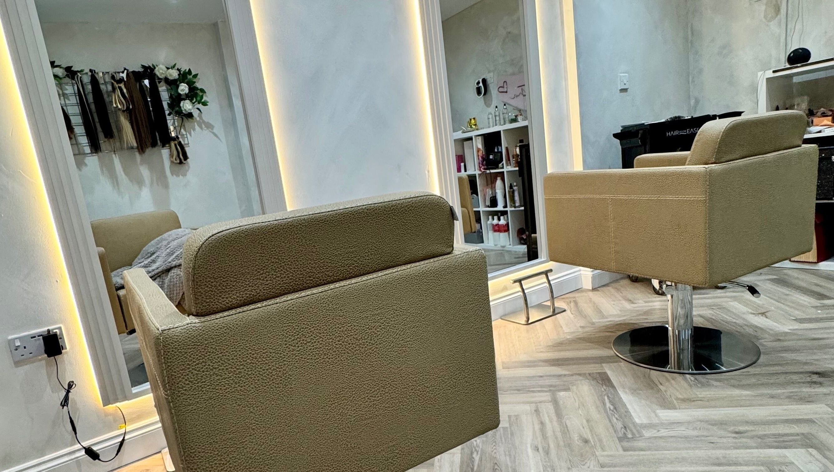 Modern salon chairs inside Valentina Hair and Skin, Sandbach, England, GB, showcasing elegant interior design.