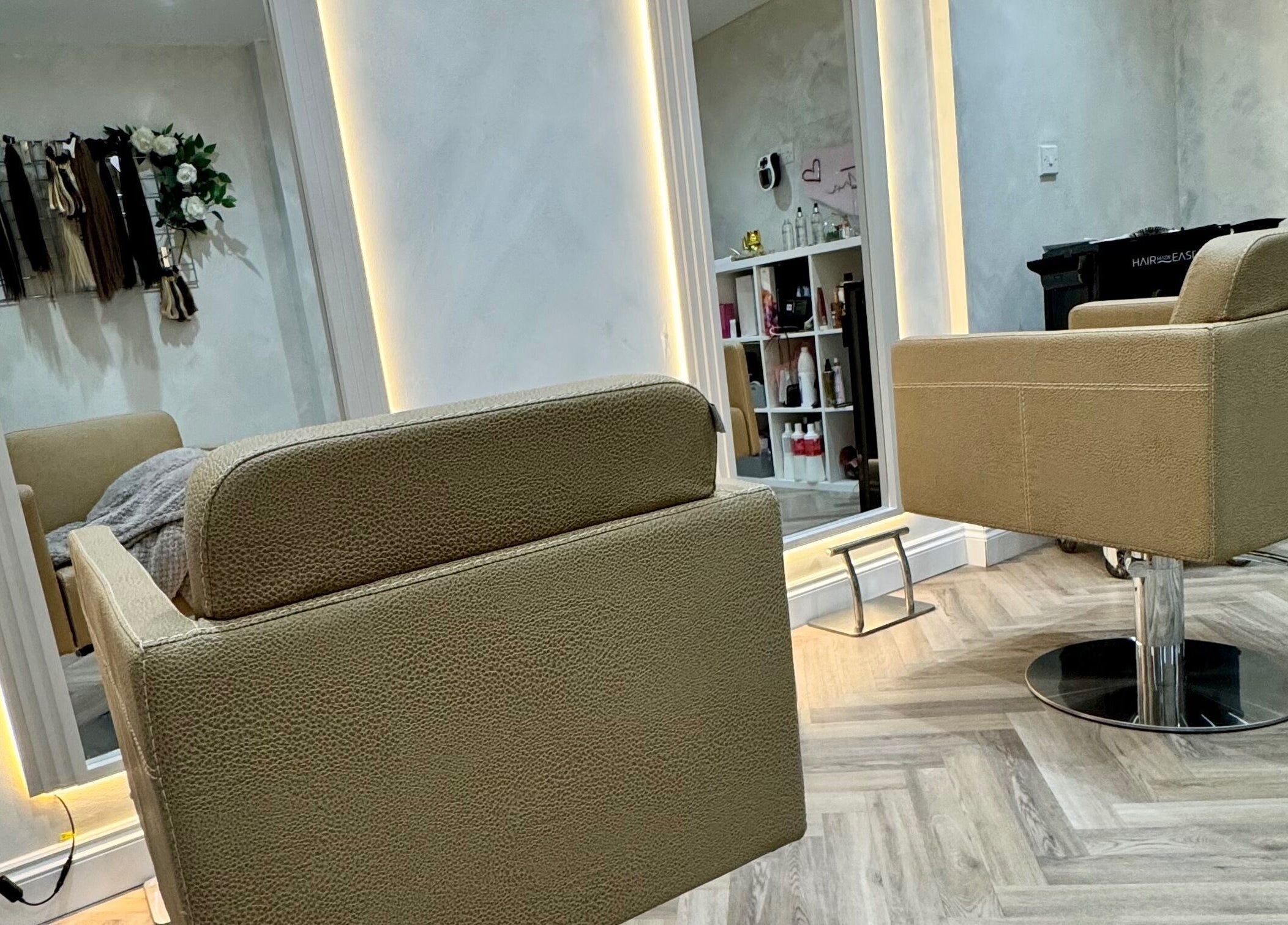 Modern salon chairs inside Valentina Hair and Skin, Sandbach, England, GB, showcasing elegant interior design.