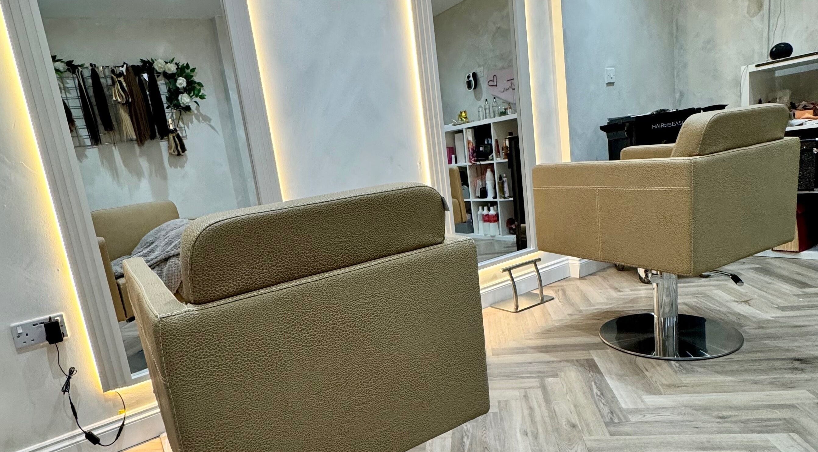 Modern salon chairs inside Valentina Hair and Skin, Sandbach, England, GB, showcasing elegant interior design.