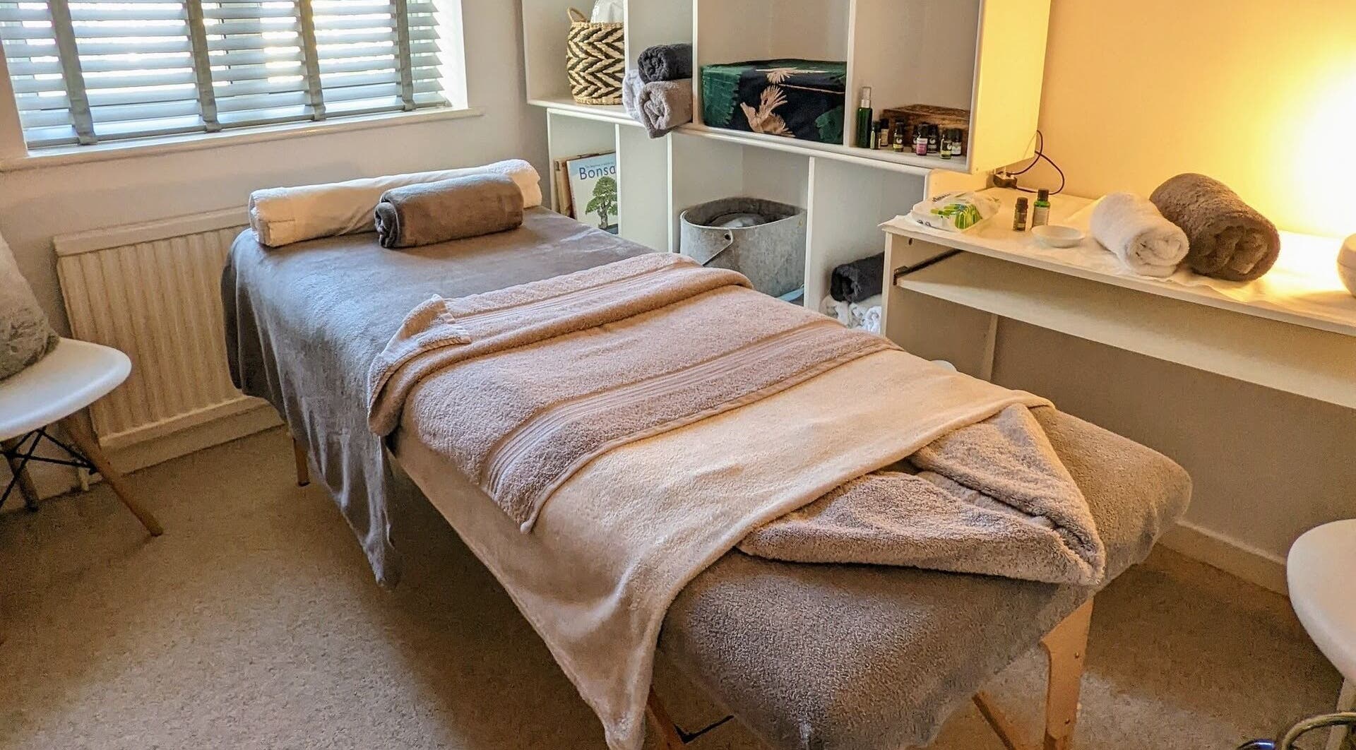 Spa treatment room at Level Head It, Cuffley, England, GB, featuring a massage table and calming decor.