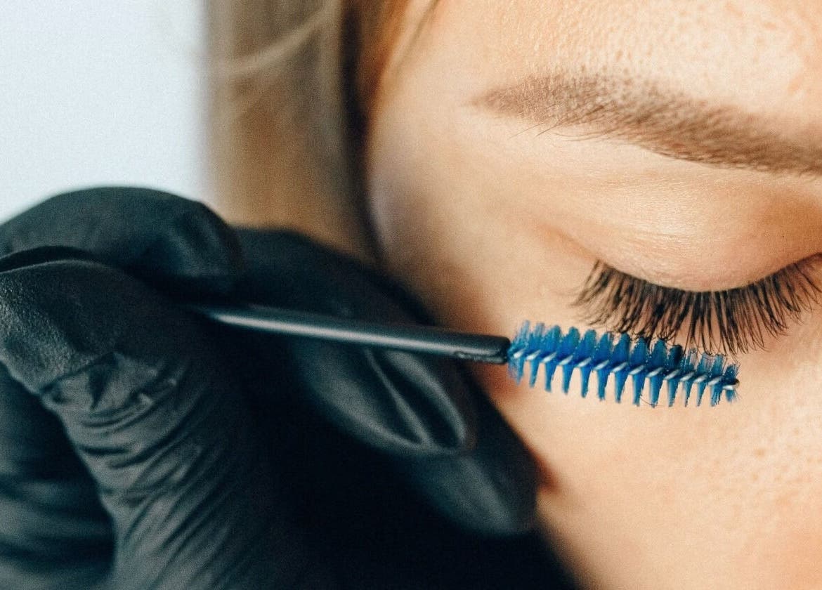 A beautician applying lash treatment at Union Lash & Brow, San Francisco, California, US.