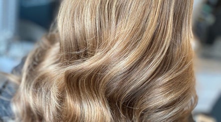 Shimmering golden blonde hair styled in soft waves at Eleanor Rose Hair, Accrington, England, GB.
