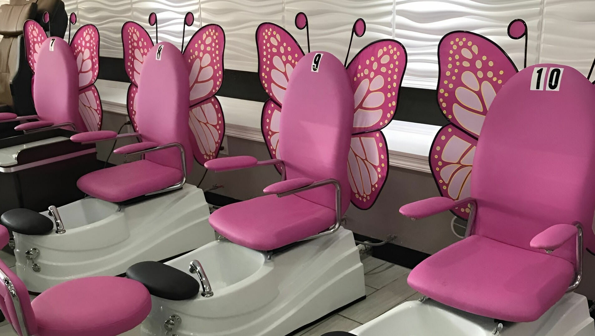 Butterfly-themed pedicure chairs at Rose Nails, Overland Park, Kansas, US, offer a whimsical spa experience.