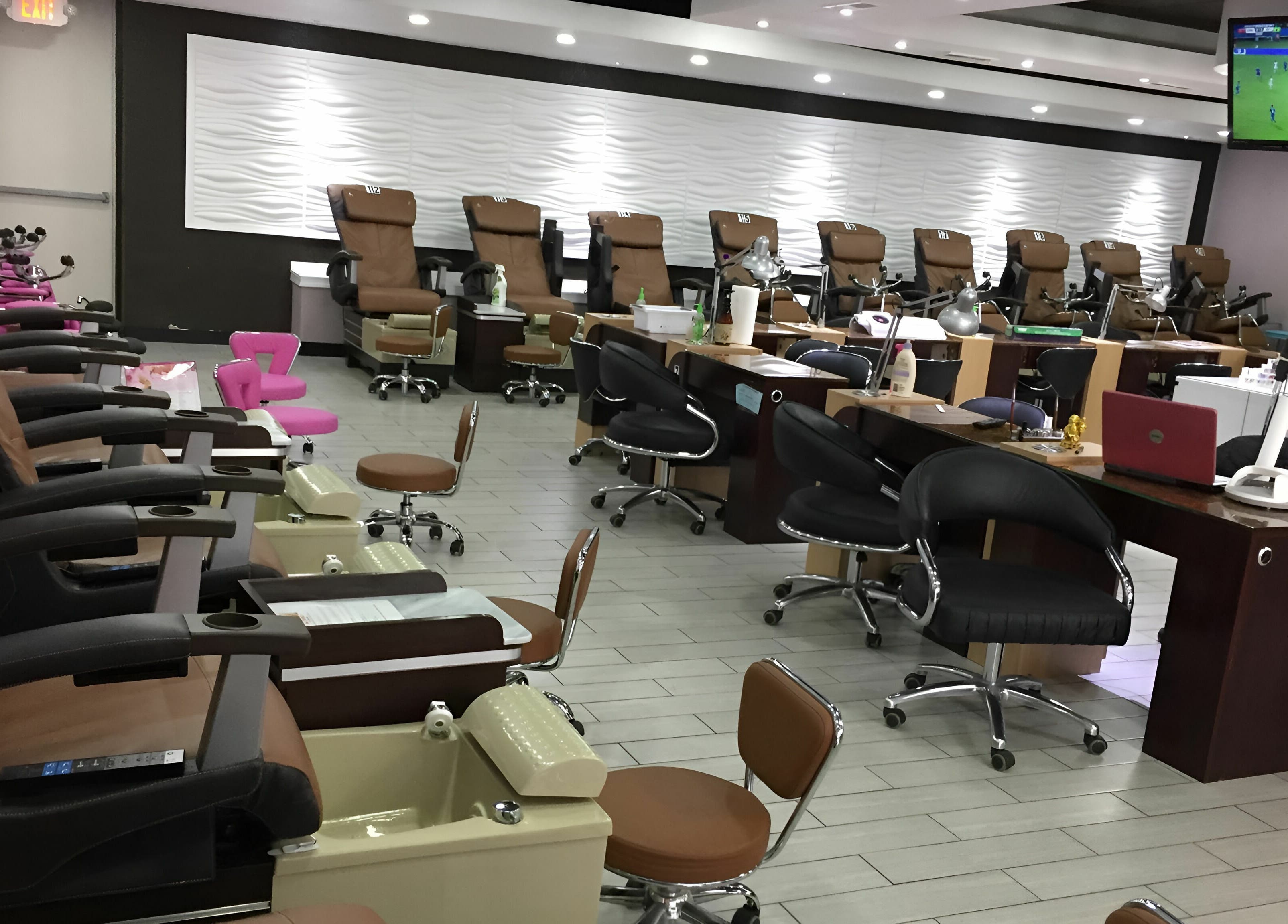 Interior of Rose Nails in Overland Park, Kansas showing luxury nail stations and modern decor.