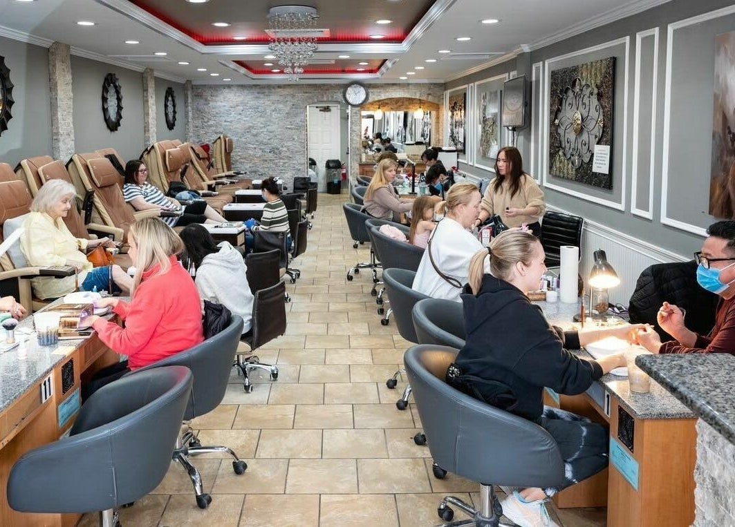 Clients receiving manicures at Rose Nails in Overland Park, Kansas, US with elegant interior decor.