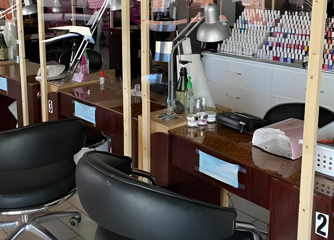 Modern nail salon stations at Rose Nails, Overland Park, Kansas, US, ready for customer pampering.