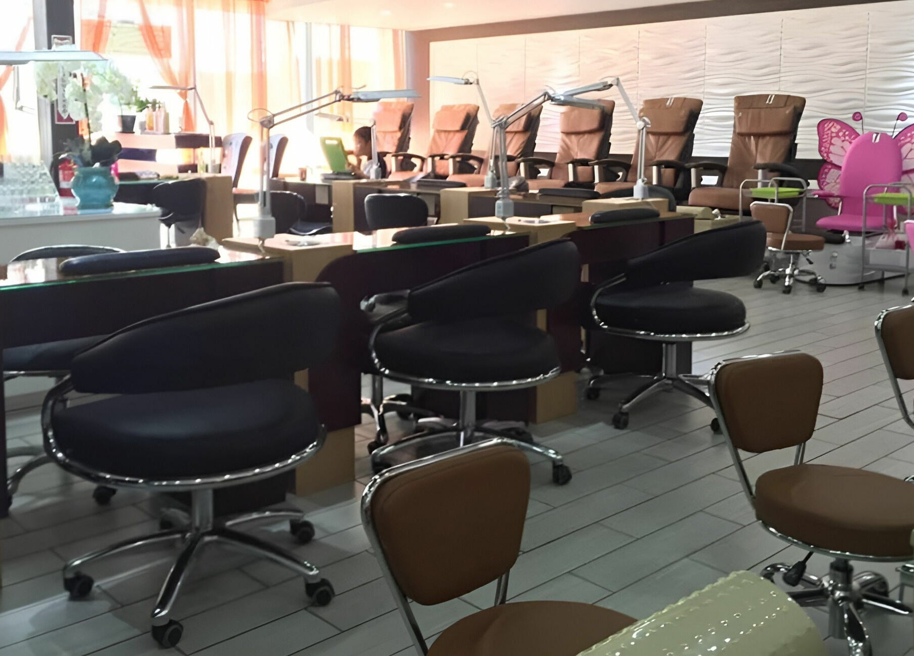 Elegant nail stations at Rose Nails in Overland Park, Kansas, US, offer comfort and style for clients.