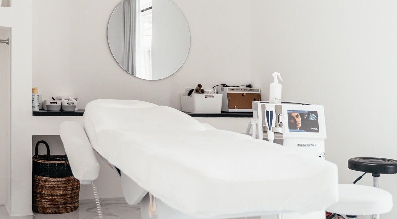 Modern treatment room at Laser Me, Bali, Bali, ID with sleek decor and advanced equipment.