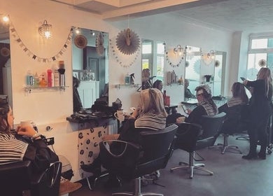 Clients enjoying treatments at Ella @ TheSalon, Norwich, England, GB. Modern ambiance and expert stylists.
