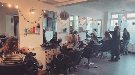 Clients enjoying treatments at Ella @ TheSalon, Norwich, England, GB. Modern ambiance and expert stylists.