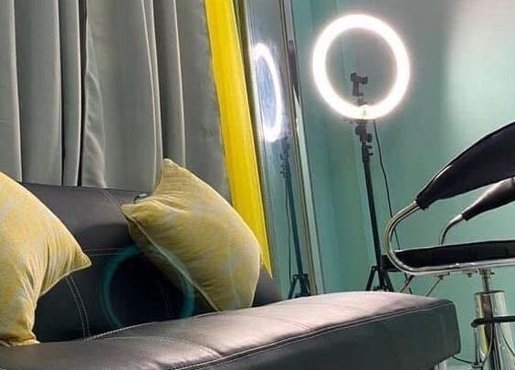 Cozy lounge area with stylish lighting at Savoir Beauty Ltd, Point Fortin, TT.