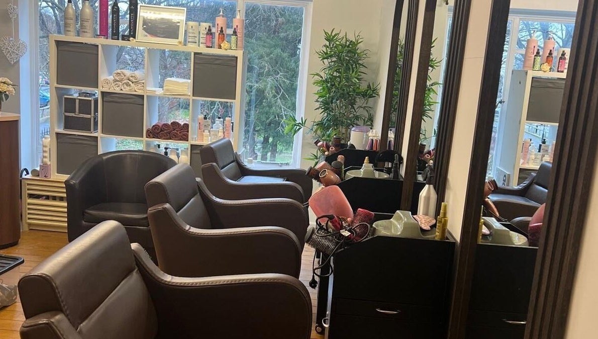Chic and inviting salon interior at Models Hair & Beauty, Colchester, England, GB, showcasing stylish seating.
