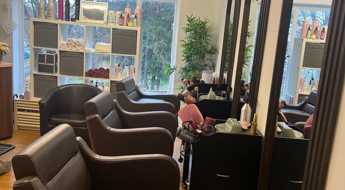 Chic and inviting salon interior at Models Hair & Beauty, Colchester, England, GB, showcasing stylish seating.