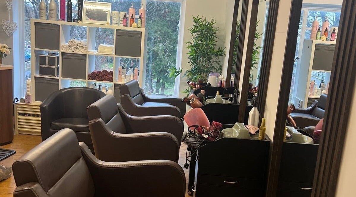 Chic and inviting salon interior at Models Hair & Beauty, Colchester, England, GB, showcasing stylish seating.