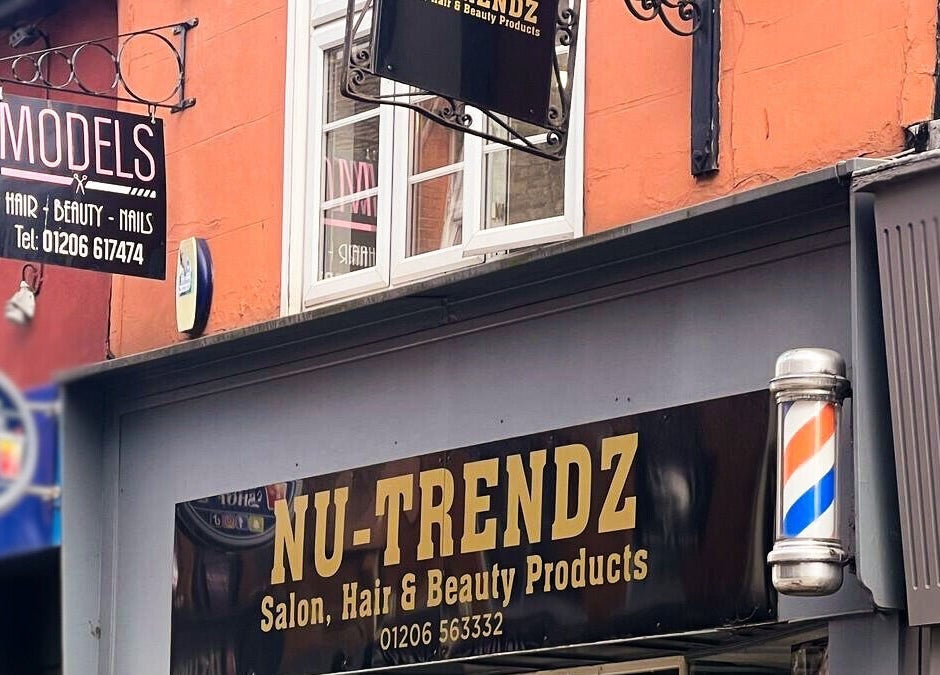 Front signage of Models Hair & Beauty in Colchester, England, GB with bold lettering and salon exterior view.