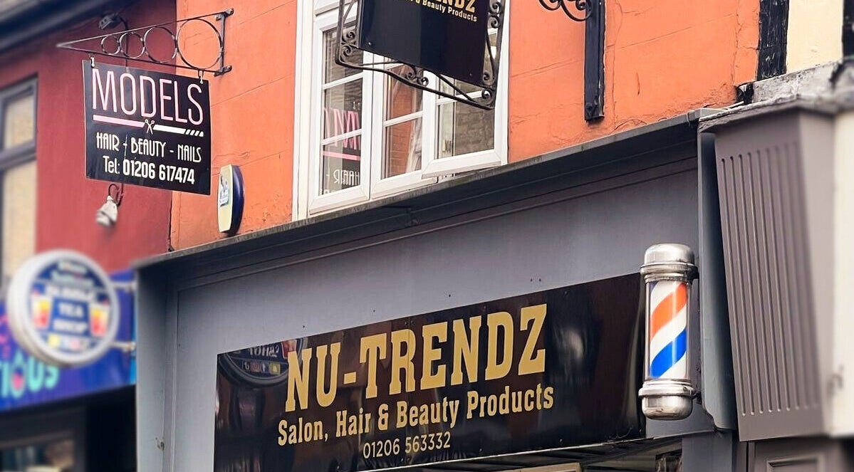 Front signage of Models Hair & Beauty in Colchester, England, GB with bold lettering and salon exterior view.