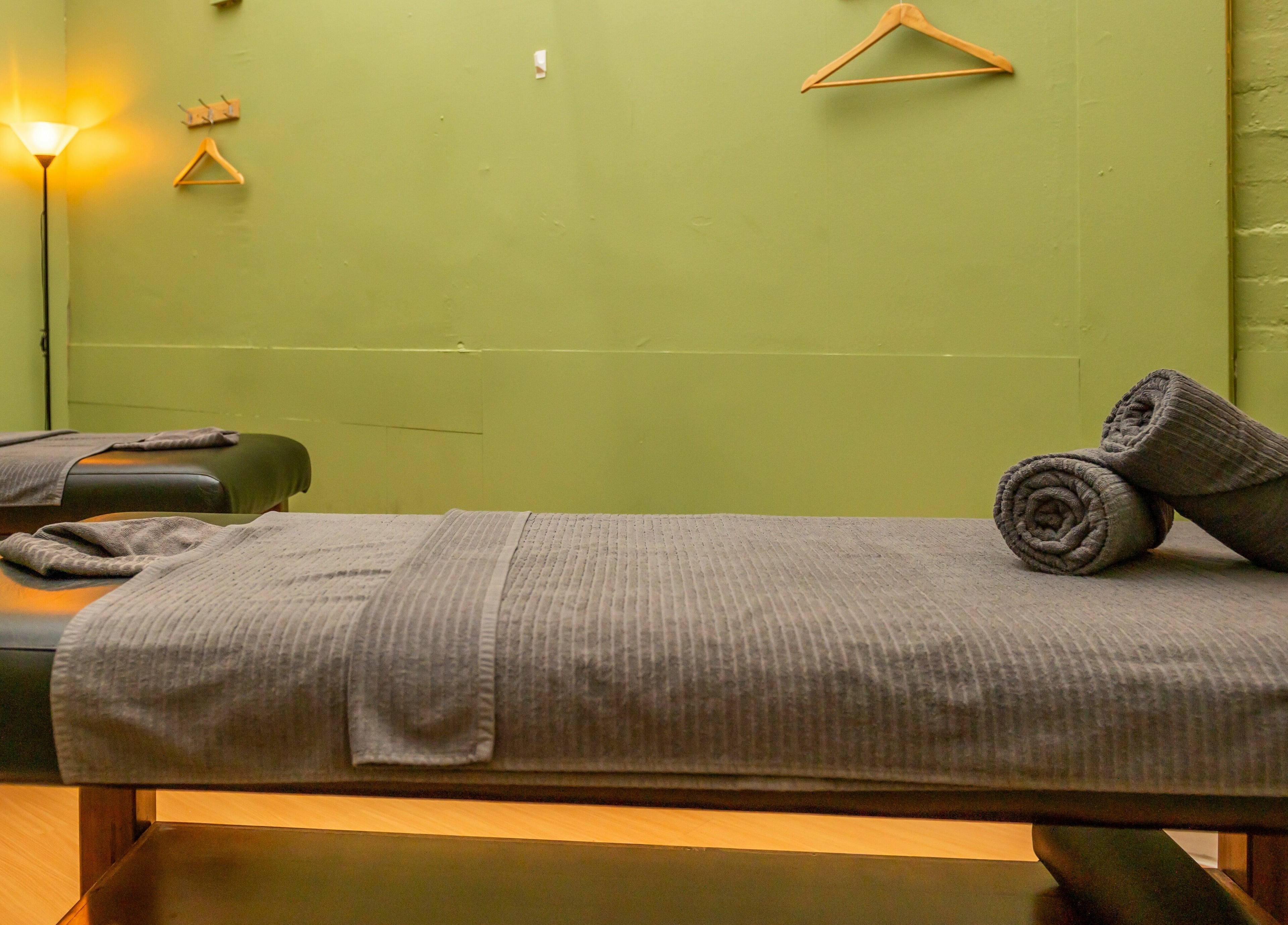 Relaxing massage room at Prahran - True Thai Massage in Prahran, VIC, AU, featuring cozy beds and ambient lighting.