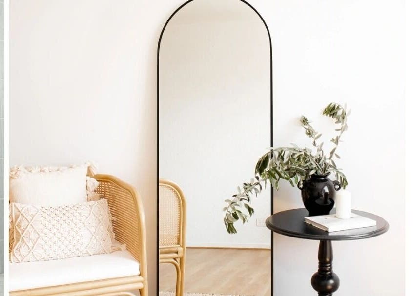 Elegant Whyte Hair salon corner in Taroomball, Queensland, AU with a mirror, chair, and table.
