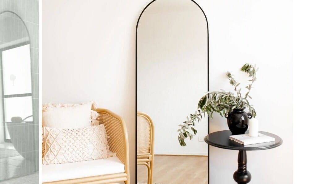 Elegant Whyte Hair salon corner in Taroomball, Queensland, AU with a mirror, chair, and table.