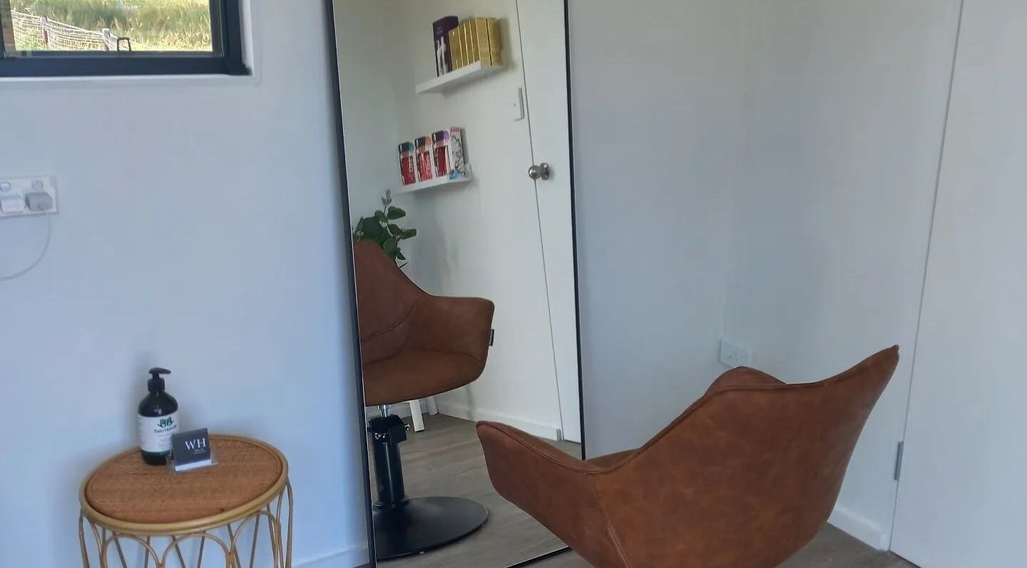 Cozy salon chair and mirror setup at Whyte Hair, Taroomball, Queensland, AU.