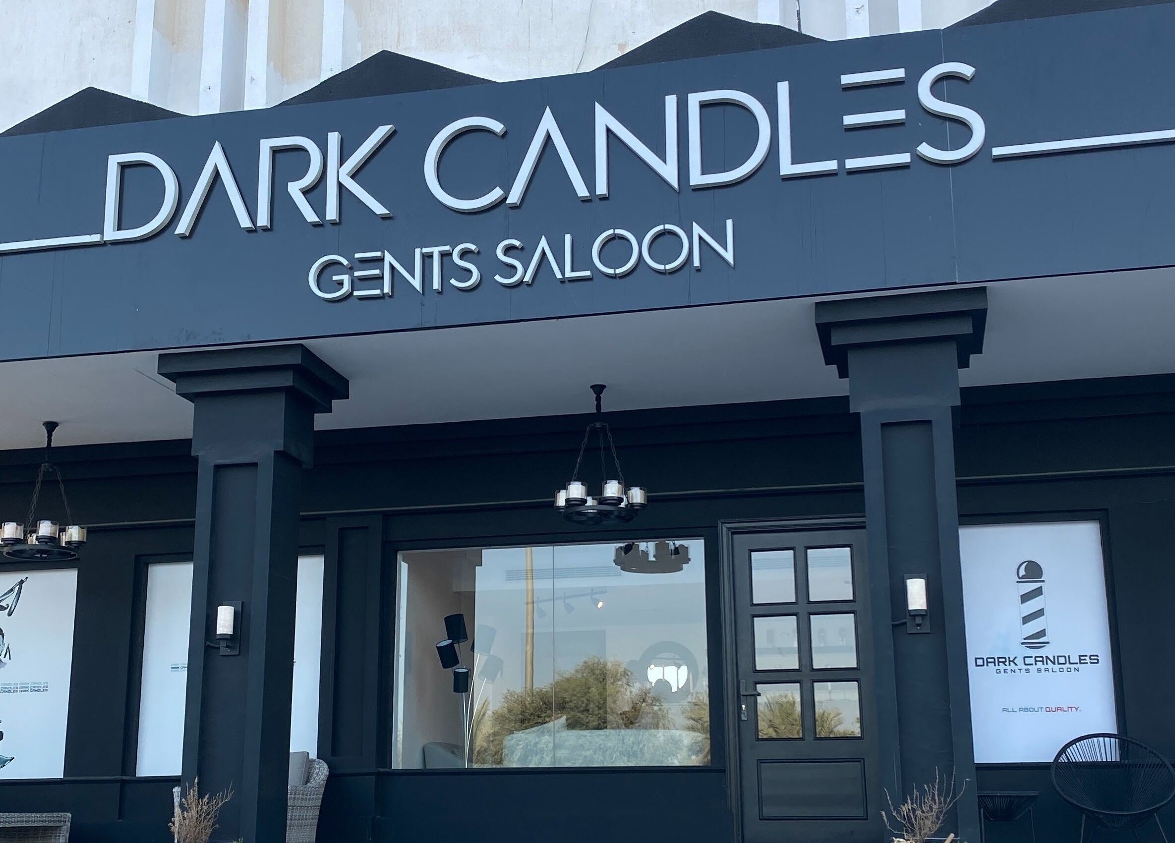 Front view of Dark Candles Saloon in Abu Dhabi, Abu Dhabi, AE, showcasing modern black exterior.