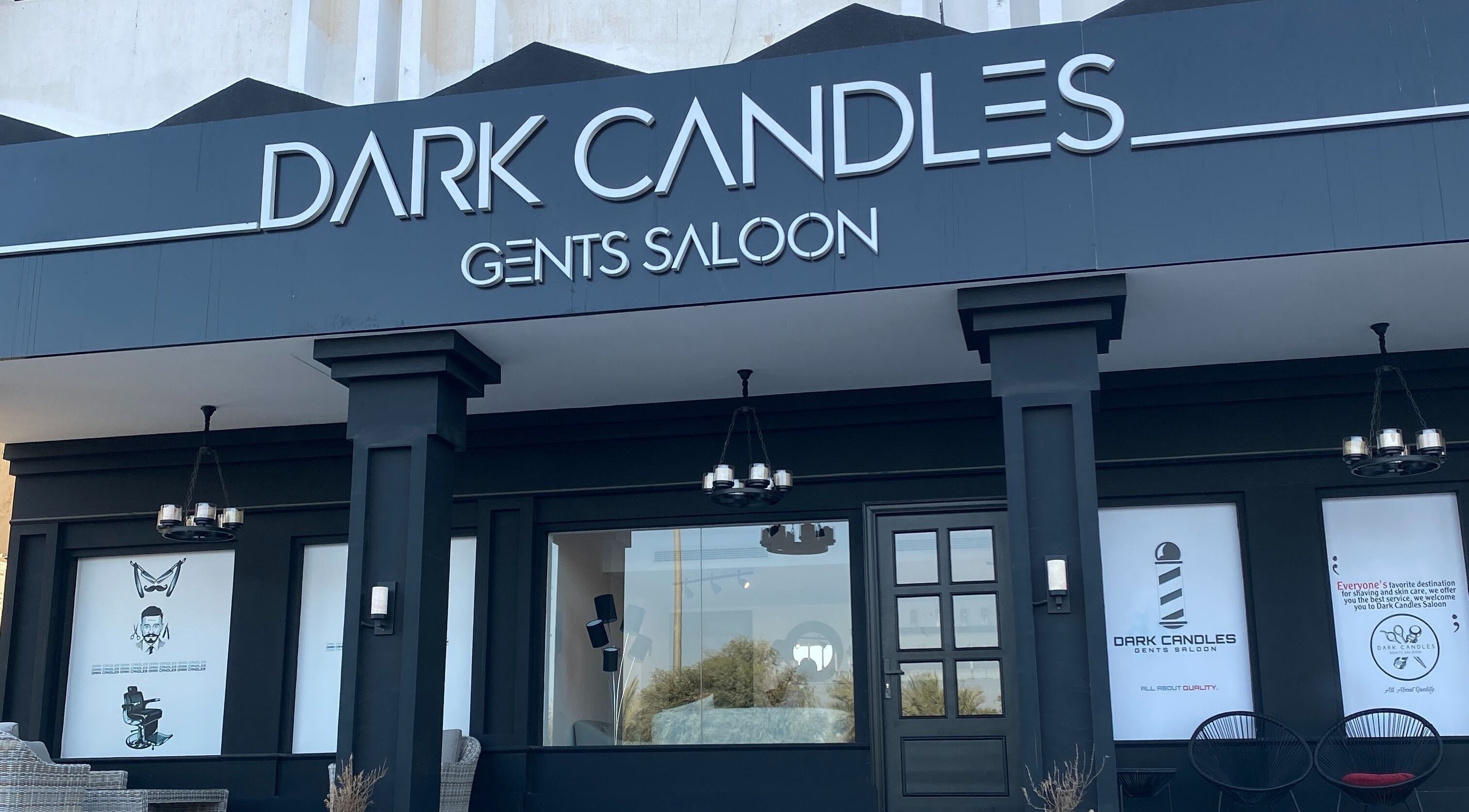 Front view of Dark Candles Saloon in Abu Dhabi, Abu Dhabi, AE, showcasing modern black exterior.