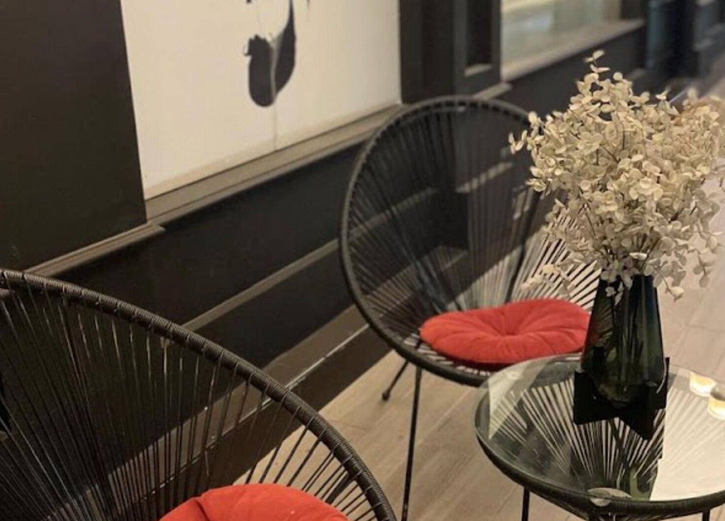 Cozy seating area at Dark Candles Saloon, Abu Dhabi, Abu Dhabi, AE, featuring stylish chairs and decor.