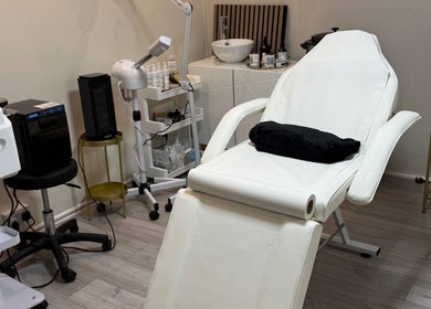 Ndila Beauty Academy's tranquil treatment room in Manchester, England, GB, featuring a comfortable spa chair.